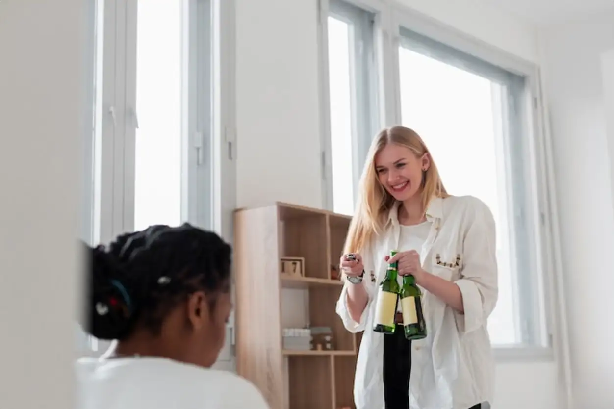 Smiley womens having beer at lunch