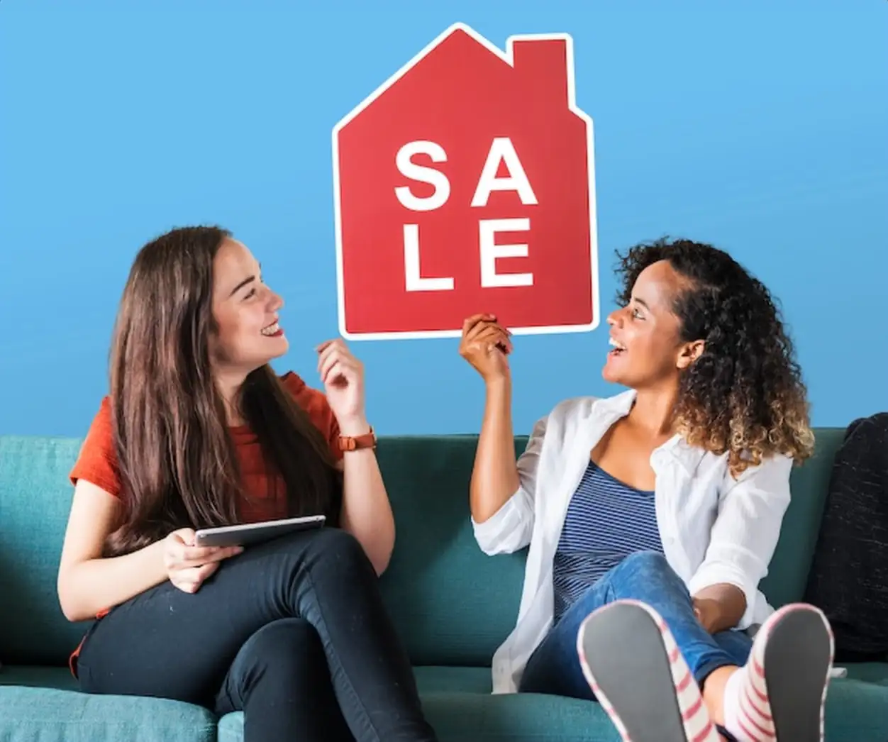 Cheerful women holding a house sales icon